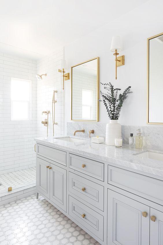 Love this beautiful timeless master bathroom with light gray vanity cabinets - bathroom ideas - bathroom decor - bathroom lighting - bathroom remodel - michelle dokey interiors