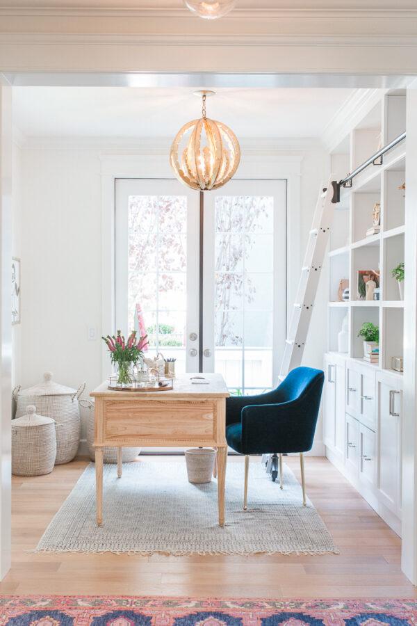 Beautiful feminine home office with blue chair and built in cabinets - sapphire diaries