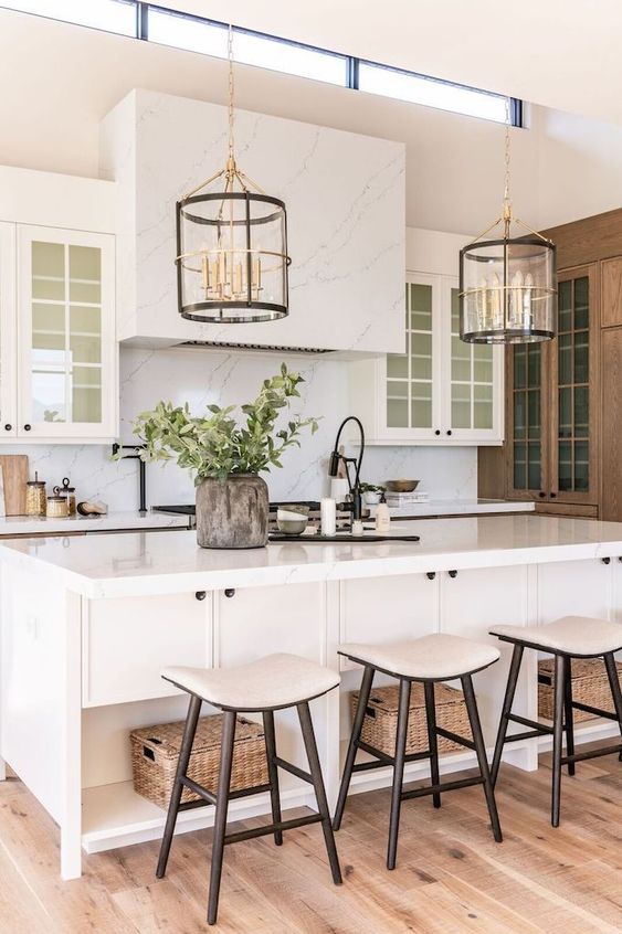 Love this beautiful kitchen design with white cabinets and kitchen island, unique glass pendant lights, and modern counter stools - kitchen ideas - kitchen decor 