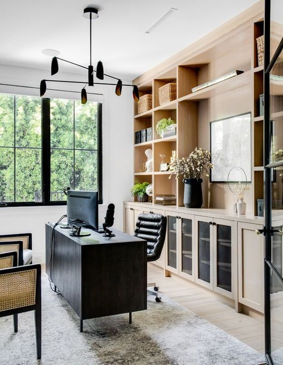 Beautiful home office and work space with built in wood cabinets and open shelving - house and home