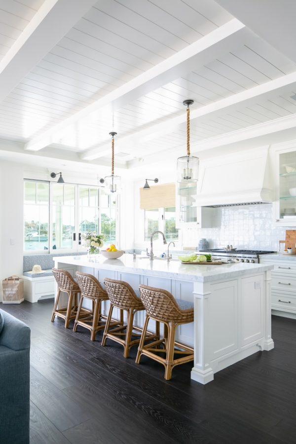 Love this beautiful timeless kitchen design with white cabinets and woven counter stools at the kitchen island - kitchen ideas - kitchen decor - kelly nutt design