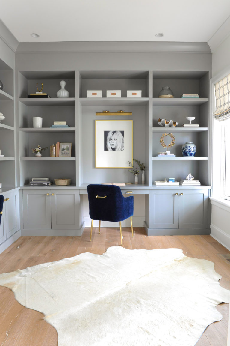 A feminine home office with blue chairs and gray built in grey cabinets - home work space ideas for her - monika hibbs
