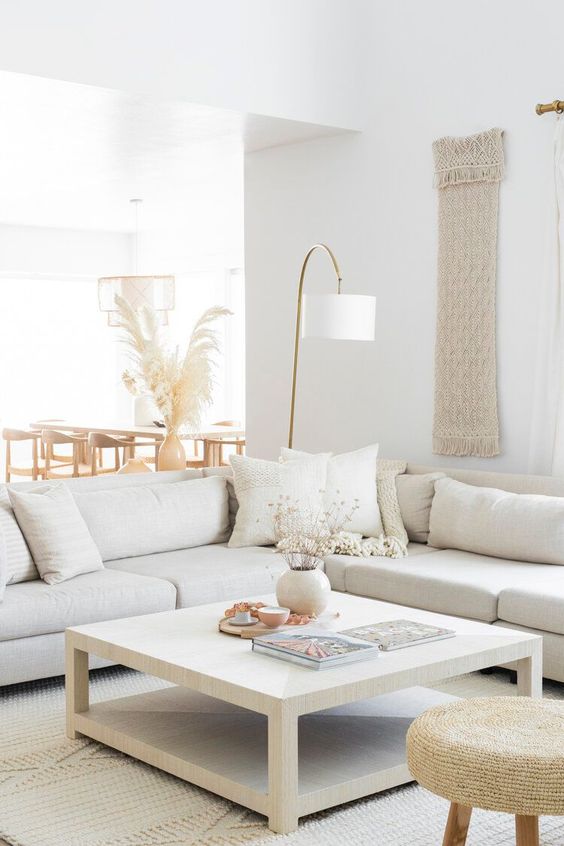 Love this beautiful light and airy modern living room with a large sectional, square coffee table, and neutral furniture and decor - ames