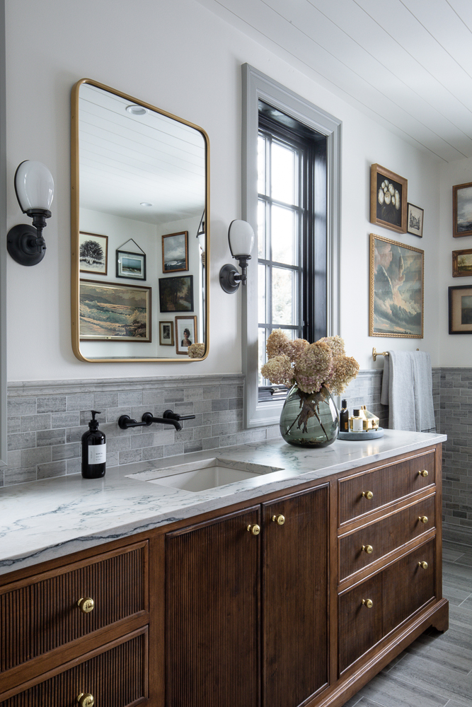Love this beautiful bathroom with a wood vanity and gallery wall - chris loves julia