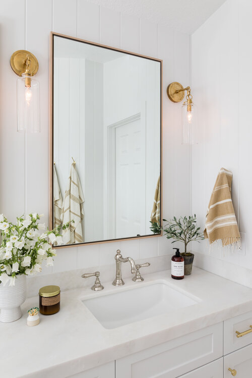 Love this beautiful bathroom design with mixed metal finishes in the brass and chrome fixtures and decor - bathroom ideas - bathroom decor - coastal style interiors - bathroom remodel - pure salt bathroom