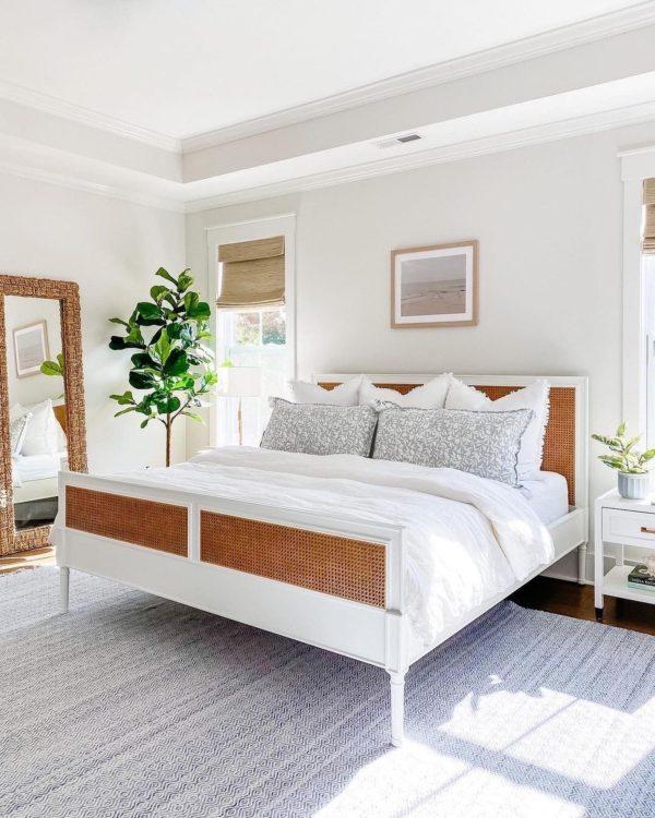 Love this beautiful bedroom design with a rattan bed, neutral bedding and decor, and modern coastal style - courtegli - bedroom ideas - luxury bedroom - bedroom setup - home decor trends - spring decor - home decor style