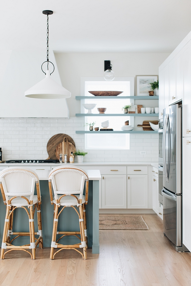 Love this beautiful modern coastal kitchen design with woven counter stools and a blue island - timber trails - julie howard - kitchen ideas - kitchen decor - kitchen remodel