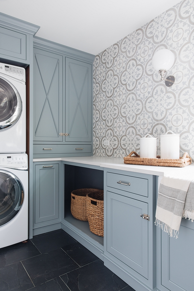 Love this beautiful laundry room design with blue cabinets and patterned wallpaper! laundry room decor - laundry room ideas - timber trails - julie howard design