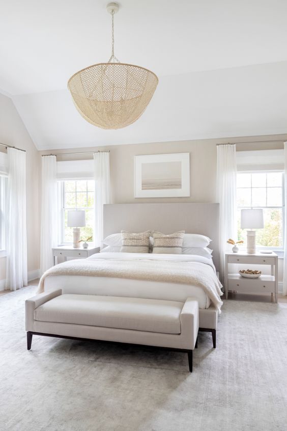 Love this light and airy transitional bedroom design with neutral bedding and furniture and a luxurious chandelier - chango and co