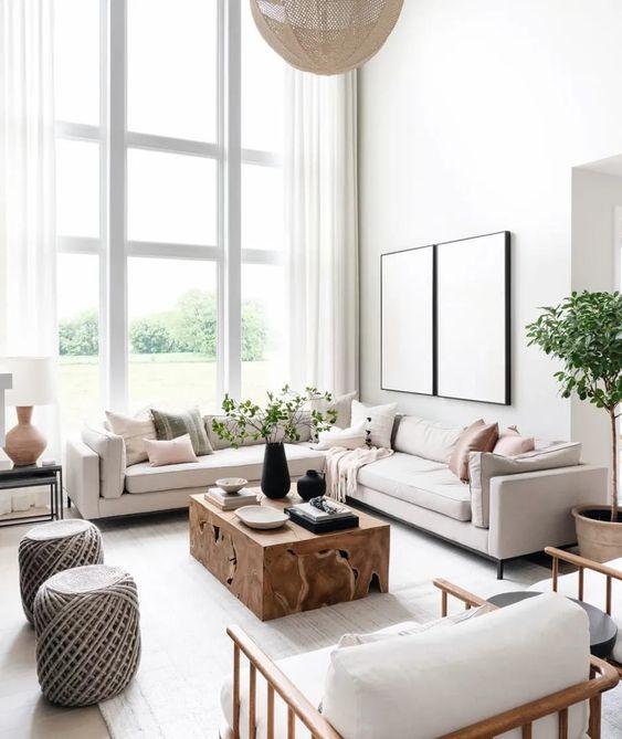 Love this beautiful living room with vaulted ceilings, abundant natural light, a large sectional, wood coffee table, and neutral decor and furniture - leclair decor