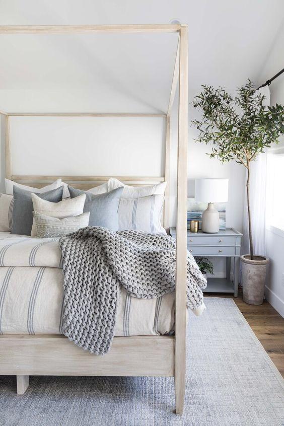 Love this beautiful bedroom design with a wood canopy bed and neutral decor and furniture - bedroom ideas - bedroom decor - coastal decor - coastal cowgirl - pure salt interiors