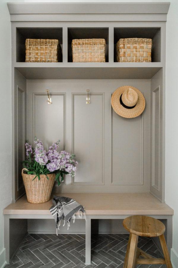 Love this beautiful mudroom with a bench for seating, cubbies for storage and organization, hooks, and panel molding - mudroom ideas - mudroom decor - entryway - laundry room - oakstone homes