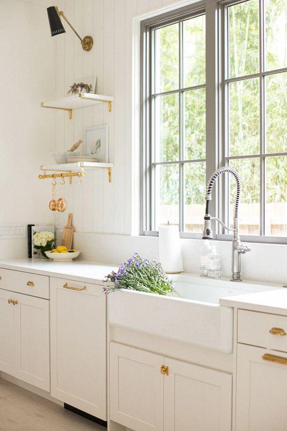 Love this beautiful timeless kitchen design with open shelves, an apron front sink and brass accents - kitchen ideas - kitchen decor - kitchen remodel - European style kitchen - modern farmhouse kitchen - work your closet
