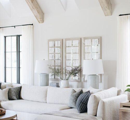 Beautiful light filled living room with wood beams and neutral tones - Kate Marker Interiors