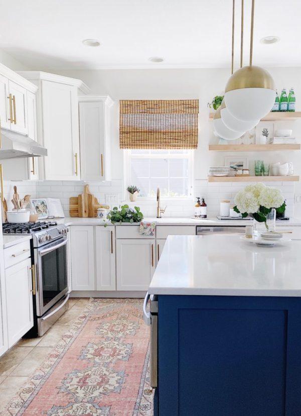 Our kitchen makeover, with painted white cabinets and a blue island - jane at home - kitchen cabinets - white kitchen - kitchen remodel - kitchen lighting - kitchen shelves - kitchen island