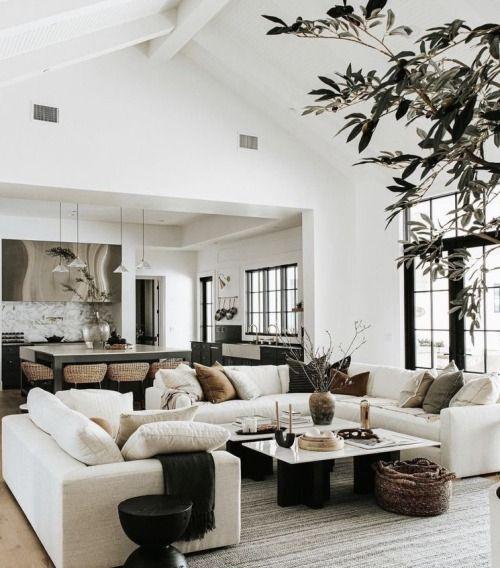 Love this beautiful living room design with marble coffee tables, a large sectional, and neutral furniture and decor - the life styled co.