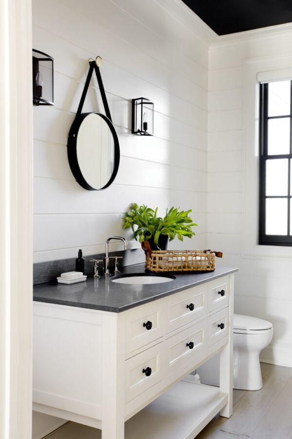 This lovely bathroom layout features a white shiplap wall treatment and a black ceiling and accents, creating either a modern farmhouse or modern coastal look, depending on which style you're going for.