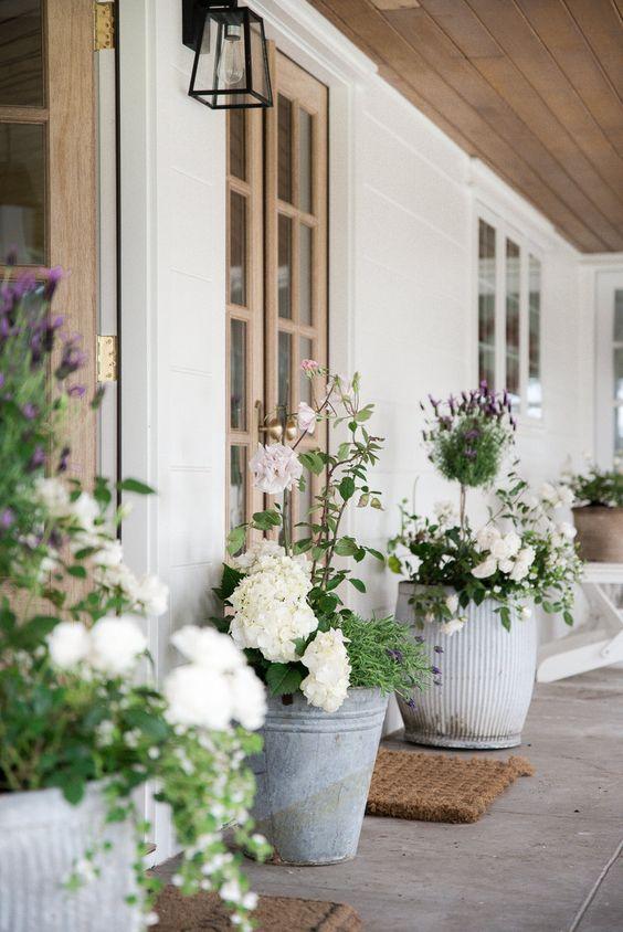 A gorgeous front porch decorated for spring - boxwood avenue