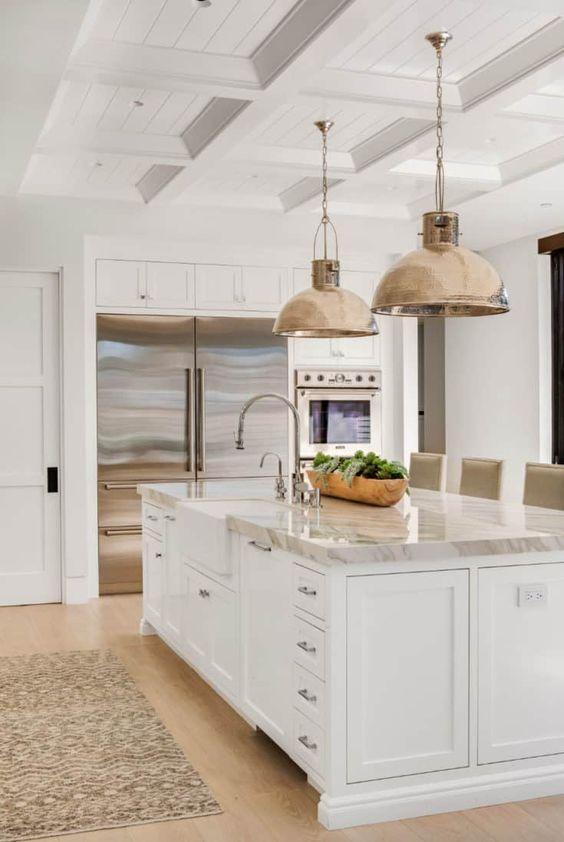 Love this beautiful timeless kitchen design with white cabinets, a coffered ceiling treatment, and a mix of brass and polished nickel metal finishes - kitchen ideas - kitchen island ideas - kitchen lighting ideas - gorgeous kitchens - kitchen trends - quiet luxury - mixed metals - brandon architects