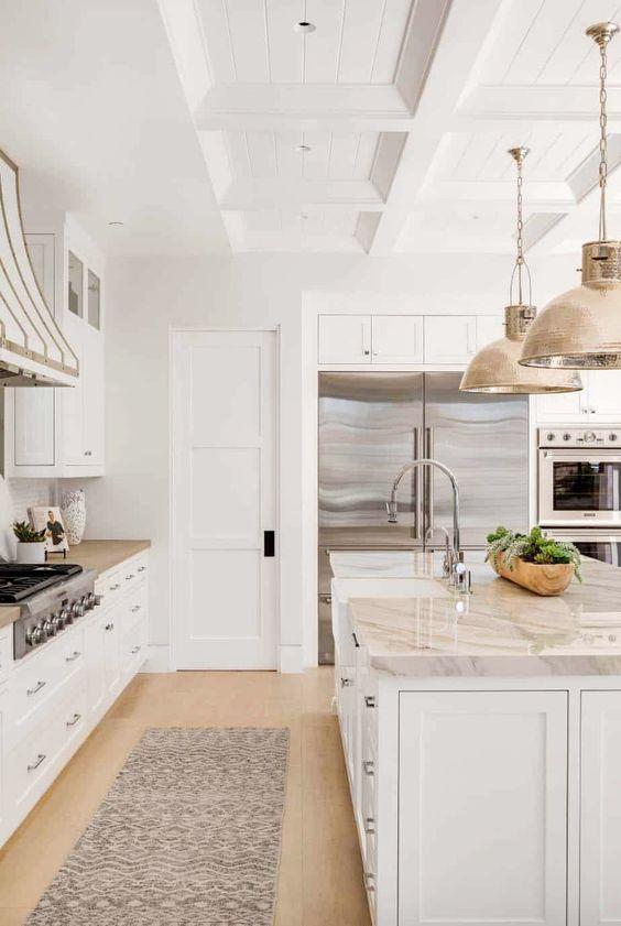 Love this beautiful timeless kitchen design with white cabinets, a coffered ceiling treatment, and a mix of brass and polished nickel metal finishes - kitchen ideas - kitchen island ideas - kitchen lighting ideas - gorgeous kitchens - kitchen trends - mixed metals - brandon architects