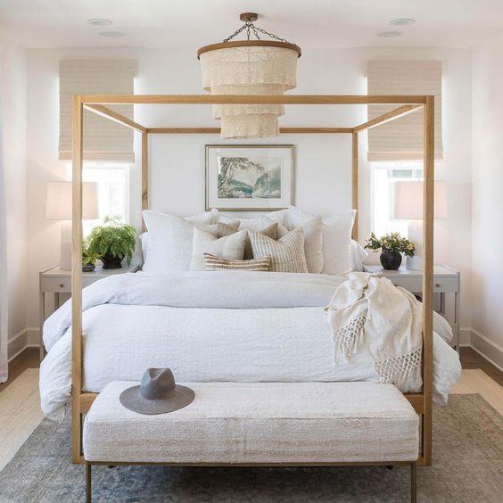 I love the light and airy feeling of this beautiful modern bedroom design with neutral furniture, bedding and decor - bedroom decor - bedroom furniture - bedroom lighting - modern coastal style - coastal bedroom - coastal decor - pure salt interiors