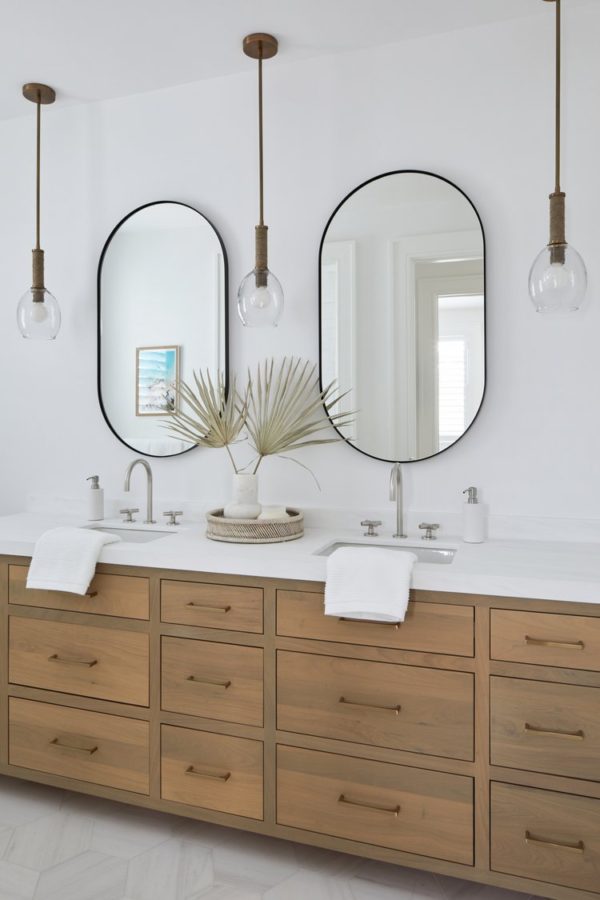 Love this beautiful modern bathroom design with a light oak wood vanity cabinet and oval mirrors - bathroom ideas - bathroom remodel - bathroom vanity - bathroom cabinet ideas - modern master bathroom - salt design 