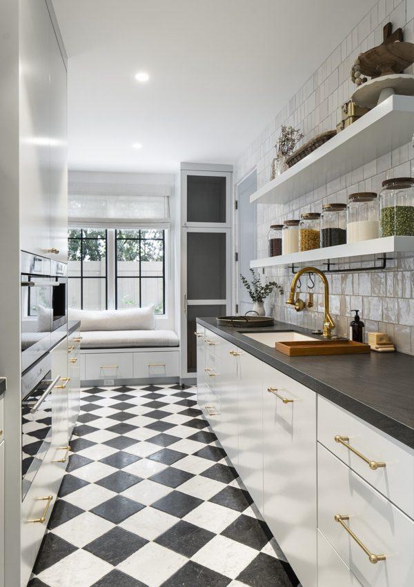 I love everything about this stunning butler's pantry, from the checkerboard tile flooring, to the built-in window seat, to the open shelving - kitchen pantry - kitchen design - kitchen flooring - kitchen ideas - timeless kitchens - brandon architects