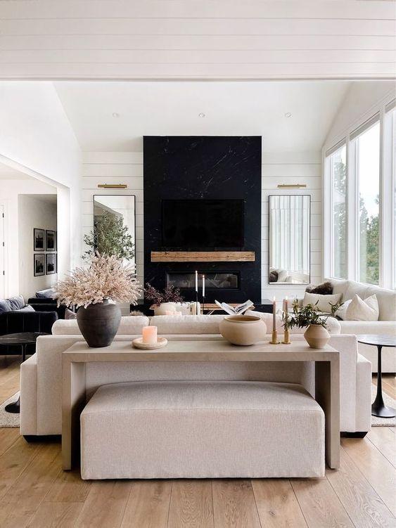 Love this stylish living room design with a wood console table, black fireplace,and neutral decor and furniture - living room decor - living room furniture - modern earthy living room - rh style - the hillary style