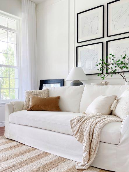 Our living room - living room wall paint color is Simply White by Benjamin Moore - jane at home