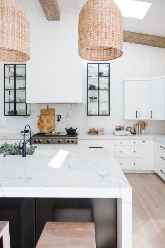 Love this beautiful modern kitchen design with waterfall countertops and woven pendant lights over the island - kitchen renovation - kitchen ideas - kitchen lighting - kitchen cabinet ideas - kitchen island ideas - kitchen backsplash ideas - the life styled co.