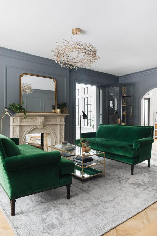 Love this beautiful and elegant living room design with dark blue wall color and two green velvet sofas - jean stoffer interiors