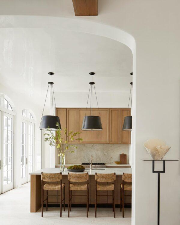 Love this beautiful modern kitchen design with woven counter stools and black pendant lights - kitchen design - kitchen decor - kitchen ideas - home decor trends and design styles - david frazier