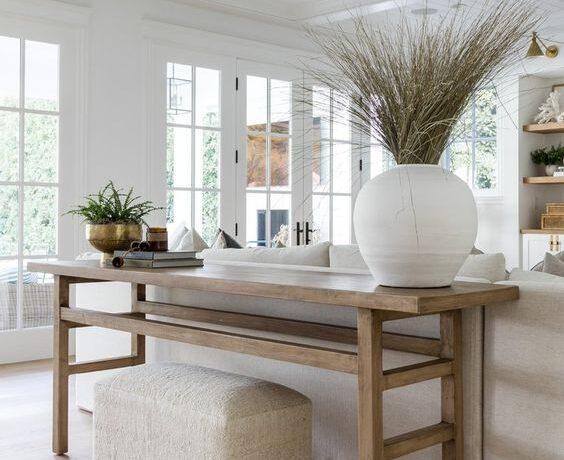 Love this beautiful living room design with a white slipcovered sofa, light wood console table, shiplap ceiling, and neutral decor and furniture - living room ideas - coastal living rooms - living room decor - coastal farmhouse - modern coastal style - cozy living room - livingrooms design - modern organic coastal living room