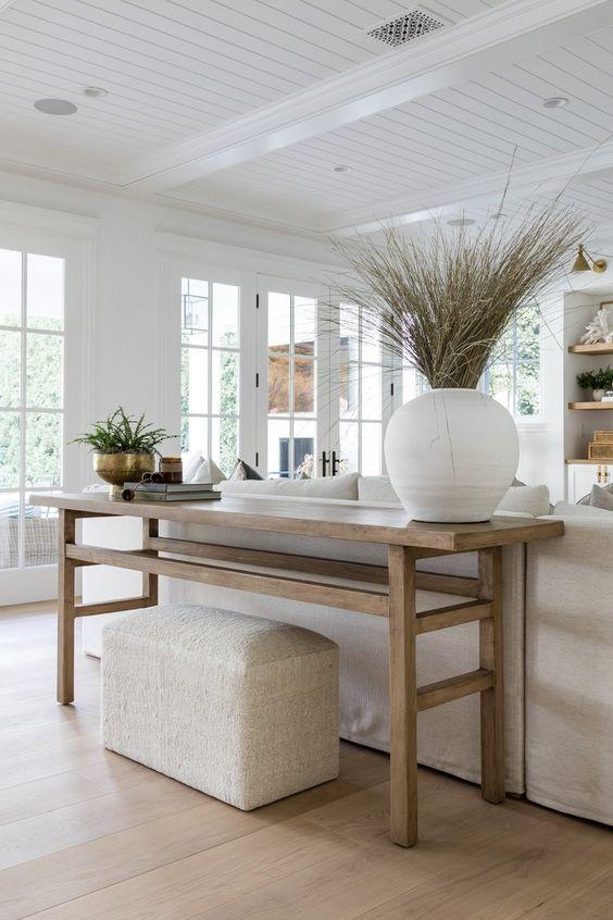 Love this beautiful coastal living room design with a white slipcovered sofa, light wood console table, shiplap ceiling, and neutral decor and furniture - living room ideas - coastal living rooms - living room decor - hamptons style - modern coastal style - coastal grandmother - organic modern decor - pure salt interiors