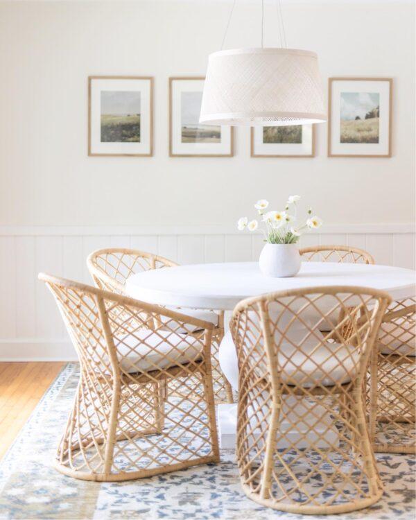 Love this beautiful modern coastal dining room with a round dining table and woven dining chairs - stephanie hoey - dining room ideas - coastal dining room - coastal interiors - coastal decor
