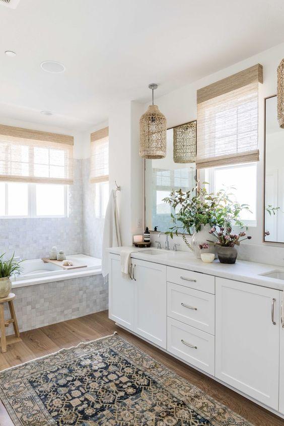 Love this beautiful modern master bathroom with a white vanity cabinet and tile tub surround - pure salt interiors