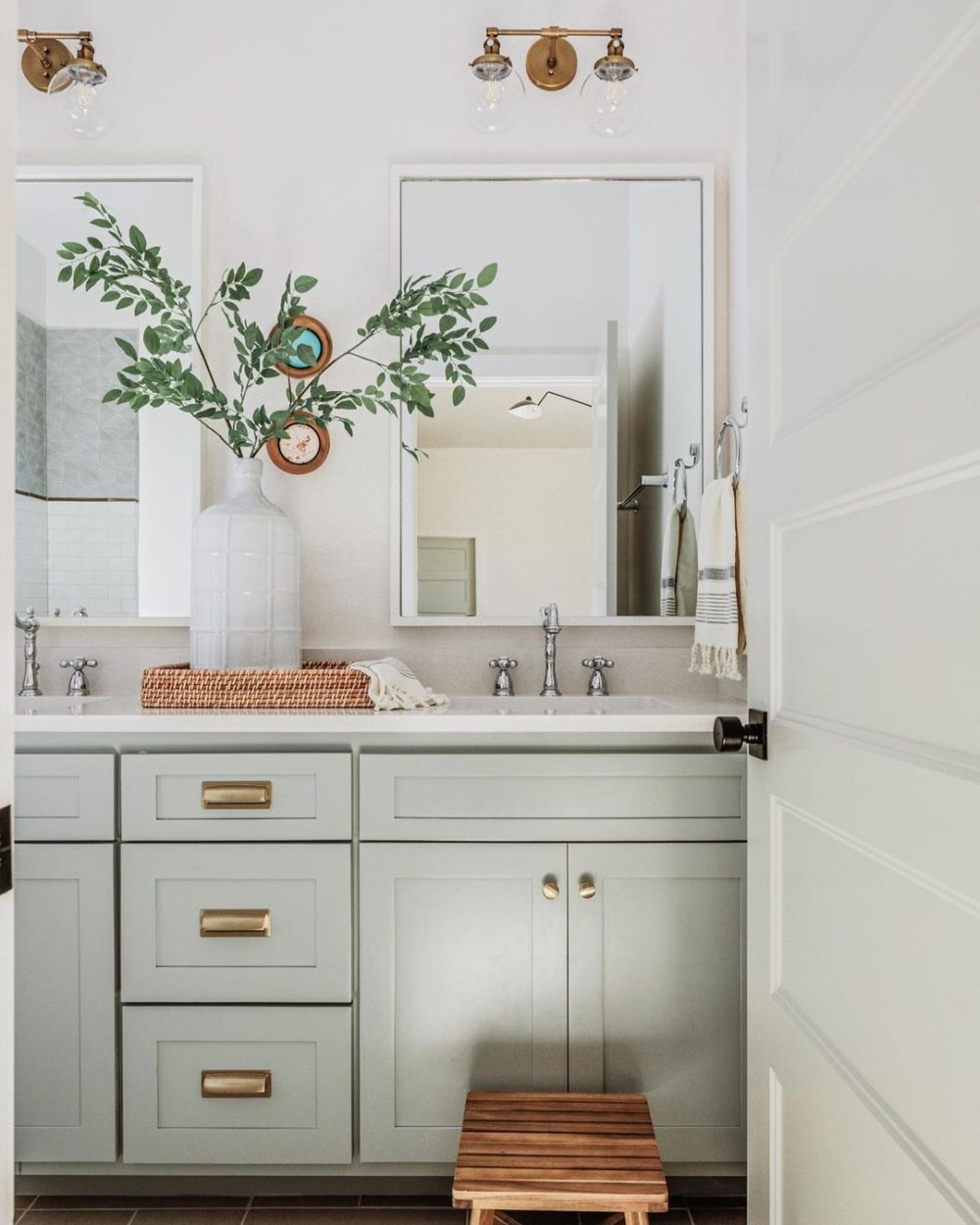 Love this beautiful bathroom design with soft gray cabinets and mixed gold and chrome metal finishes - bathroom ideas - bathroom vanity - bathroom cabinets - bathroom remodel - kelsey leigh