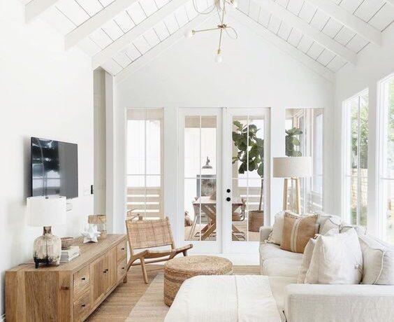 Love this gorgeous modern living room design with a sectional, vaulted ceilings, and neutral furniture and decor - beach house living room - modern coastal living room - organic modern living room - california casual style - coastal living rooms - cloth & main
