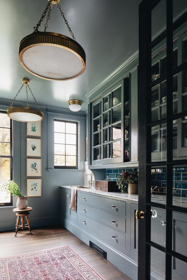 Love this beautiful kitchen pantry with dark blue green cabinets and brass accents - jean stoffer interior design