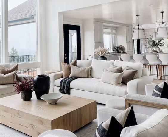 Love this beautiful modern living room design with a wood coffee table and light neutral decor and furniture - the hillary style
