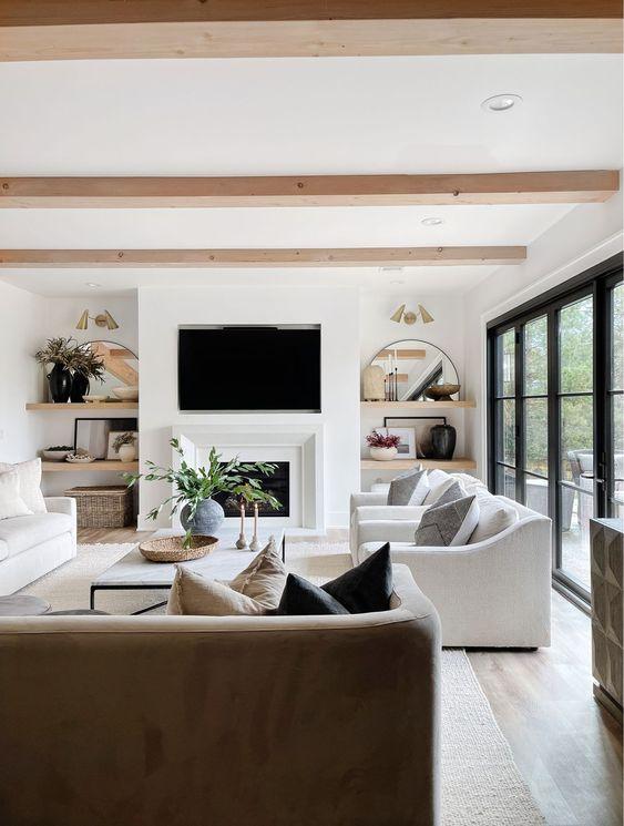 A neutral color scheme brings a sophisticated look to this light-filled living room - the hillary style