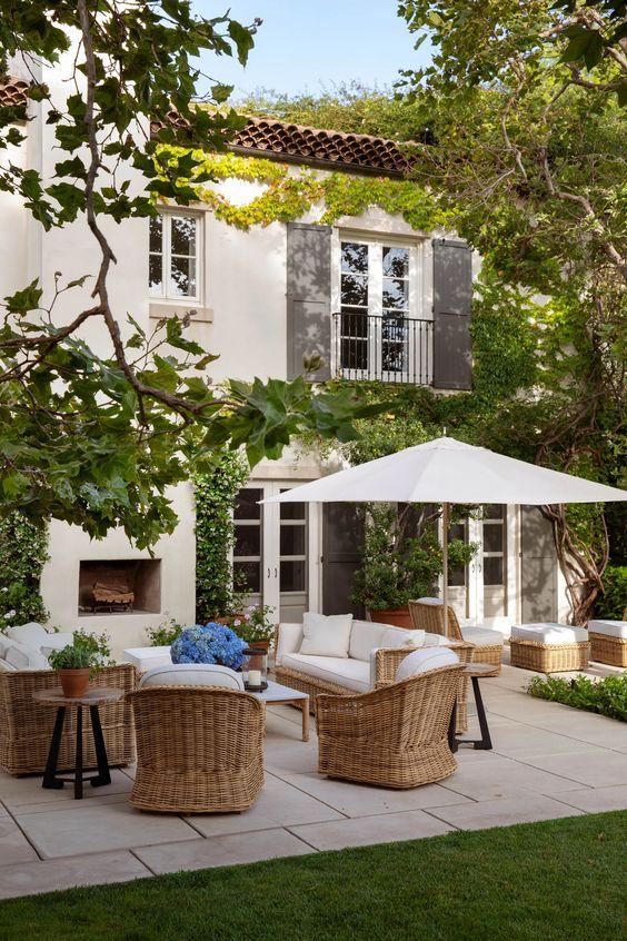 Love this beautiful outdoor living area and patio belonging to nancy meyers, complete with an outdoor fireplace and gorgeous landscaping - arch digest