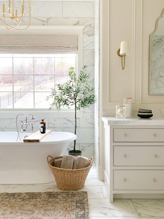 Love this beautiful bathroom design with a freestanding tub and light neutral decor - studio mcgee