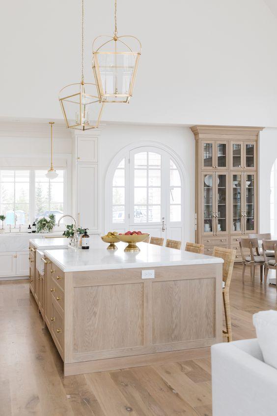 Love this beautiful kitchen design with a mix of white oak and white kitchen cabinets - cambridge home company - the cabinet gallery utah