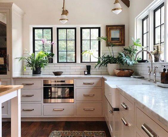 Love this beautiful kitchen with vaulted cathedral ceilings and a vintage rug