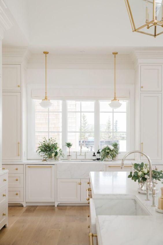 Love this beautiful kitchen design with a mix of white oak and white kitchen cabinets - cambridge home company - the cabinet gallery utah