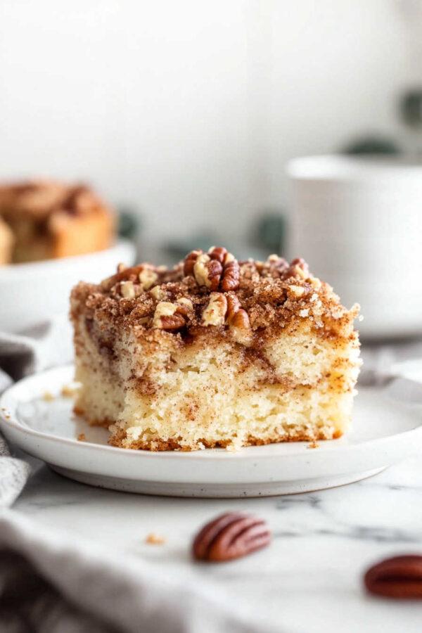 Your family will love this old fashioned coffee cake recipe infused with sour cream, cinnamon, and a crumbly pecan topping. Perfect for breakfast, brunch, snacks, or dessert - jane at home