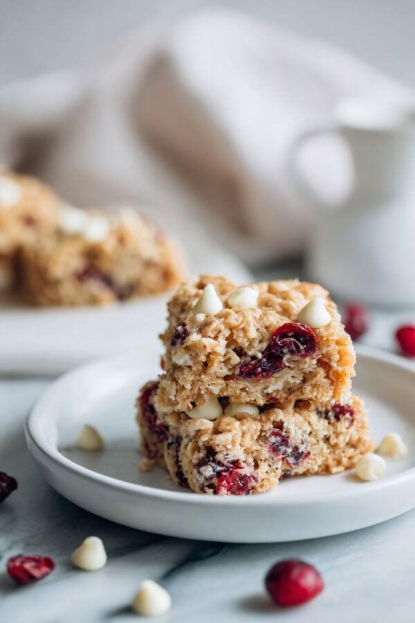 These rich and buttery oatmeal blondies are made in one bowl and packed with white chocolate chips and dried cranberries for a quick and easy dessert, snack, or breakfast everyone loves!