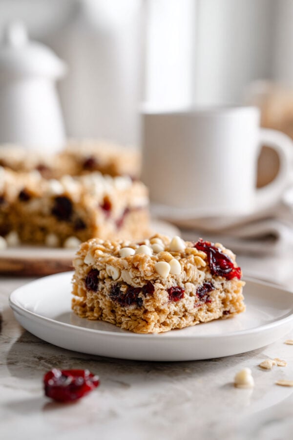 These rich and buttery oatmeal blondies are made in one bowl and packed with white chocolate chips and dried cranberries for a quick and easy dessert, snack, or breakfast everyone loves!