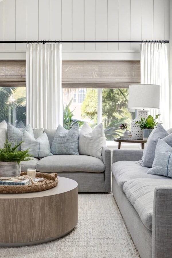 Love this beautiful living room design with a soft neutral color palette, shiplap walls, and a chic modern coastal aesthetic - Shannon Weller Design